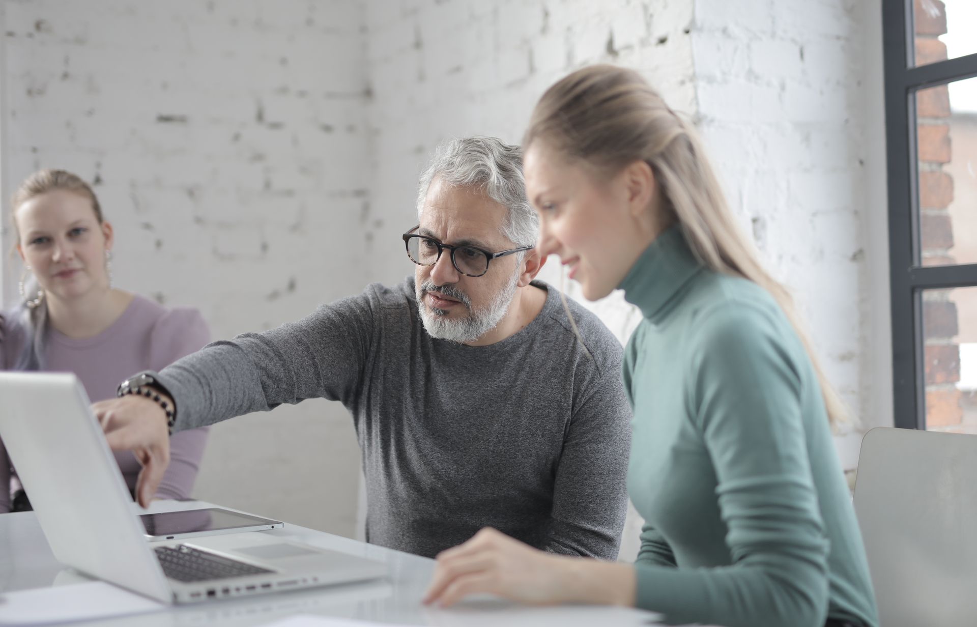 Reviewing work together on a laptop